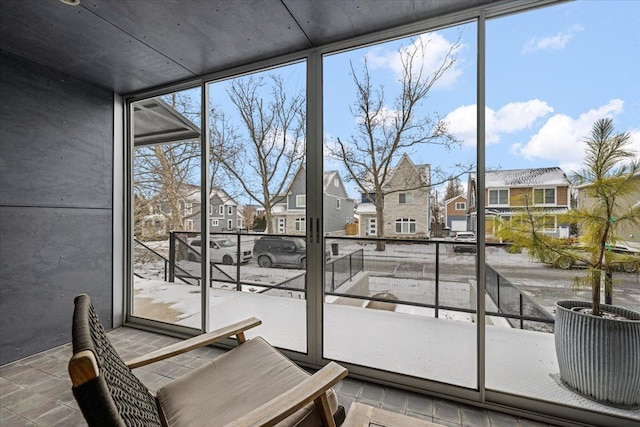 sunroom with a residential view