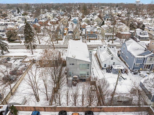 snowy aerial view featuring a residential view