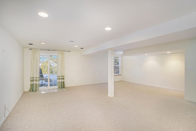 basement with recessed lighting, light carpet, and baseboards