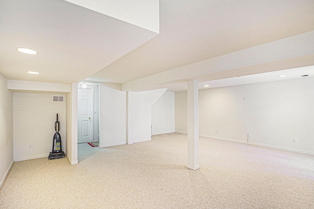 finished basement with visible vents, baseboards, carpet flooring, and recessed lighting