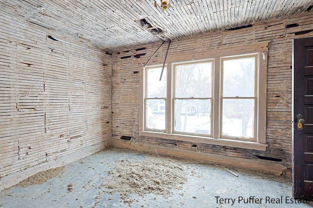 unfurnished room featuring plenty of natural light