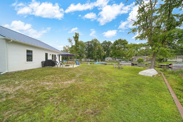 view of yard featuring fence and a gazebo