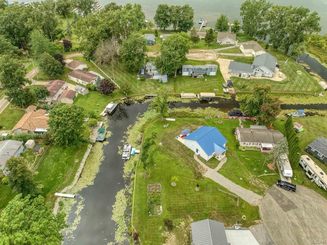 drone / aerial view featuring a water view and a residential view