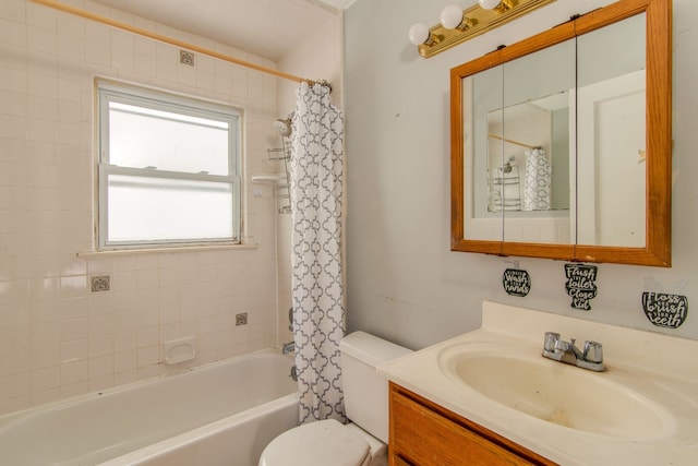 full bathroom featuring vanity, shower / tub combo, and toilet