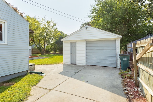 detached garage featuring driveway