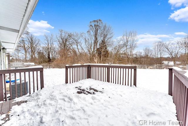 snow covered deck with central AC unit