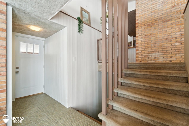 stairway with brick wall