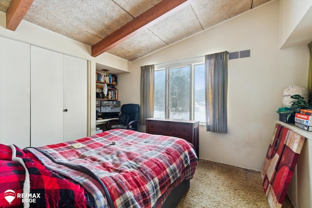 bedroom with vaulted ceiling with beams, a closet, carpet, and visible vents