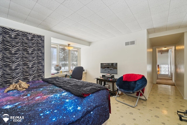 carpeted bedroom featuring visible vents