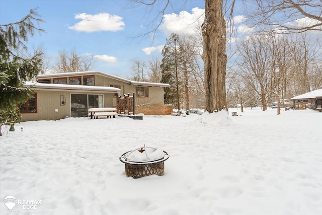 view of snow covered house