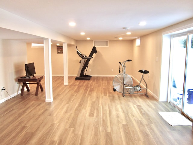 exercise room with recessed lighting, light wood-type flooring, visible vents, and baseboards