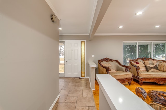 living room featuring recessed lighting, crown molding, and baseboards