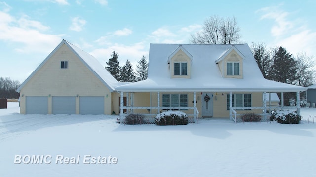 view of front of house with a garage and covered porch