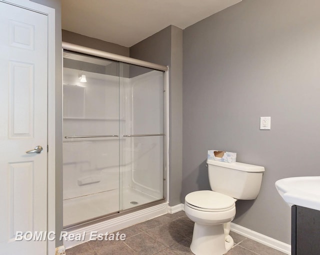 full bathroom featuring toilet, a stall shower, tile patterned flooring, and baseboards