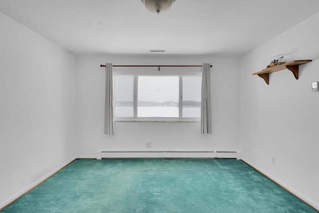 unfurnished room with dark carpet, a baseboard radiator, and visible vents