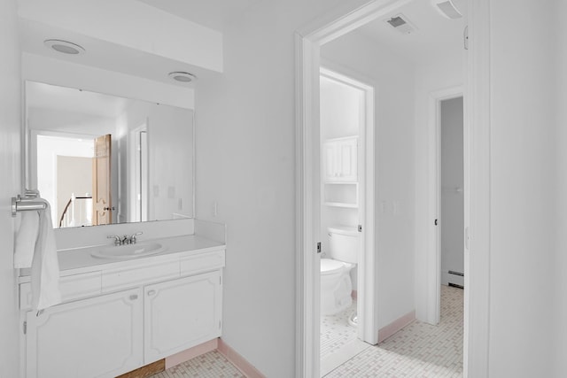 bathroom with visible vents, baseboards, toilet, a baseboard radiator, and vanity