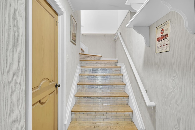 stairs with wood finished floors