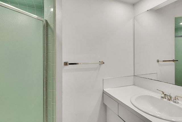 full bathroom featuring an enclosed shower and vanity