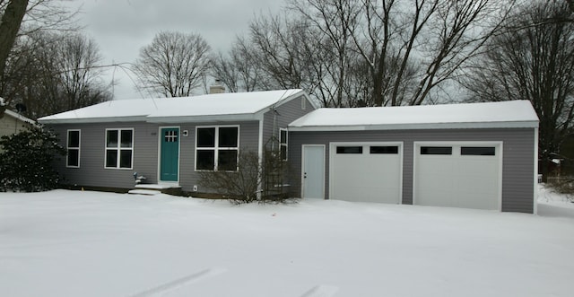 single story home with entry steps, a chimney, and an attached garage