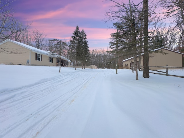 view of yard layered in snow