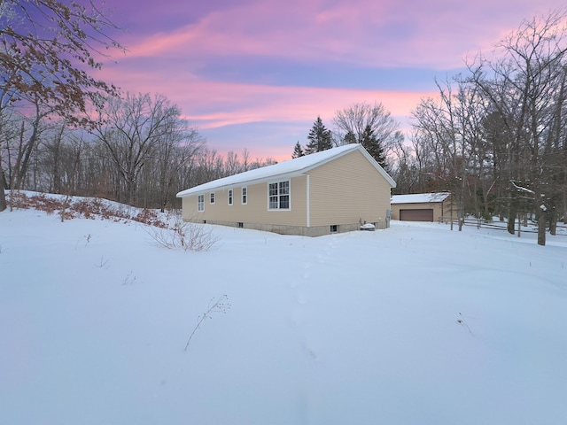 exterior space with a detached garage