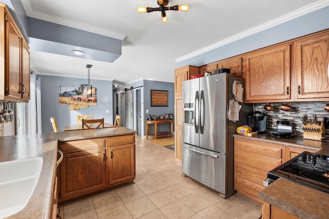 kitchen with ornamental molding, hanging light fixtures, stainless steel fridge with ice dispenser, and a barn door