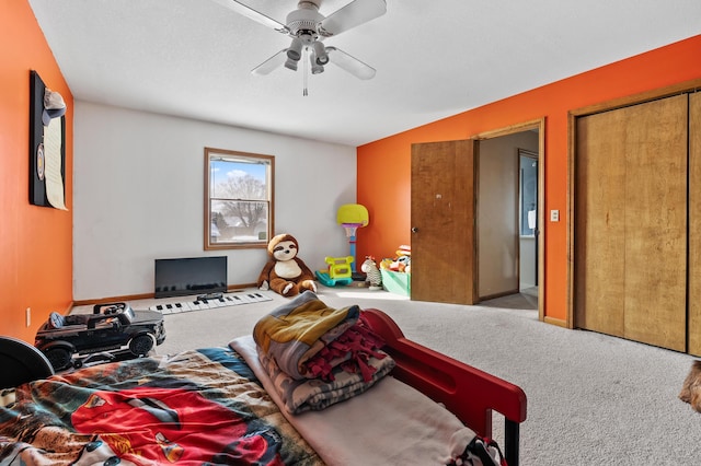 bedroom featuring carpet, baseboards, and a ceiling fan