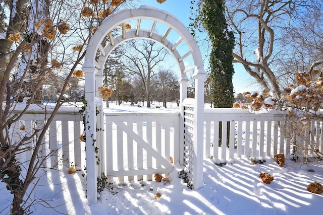 view of snow covered gate