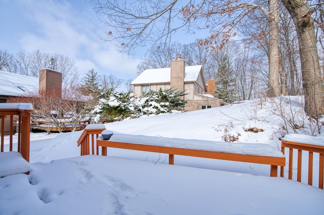 view of yard layered in snow