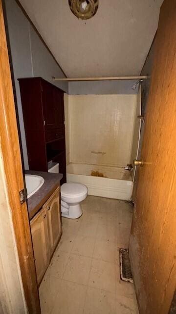 bathroom with vaulted ceiling, a shower, vanity, and tile patterned floors