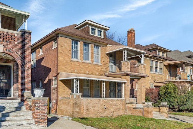 view of front of house featuring brick siding