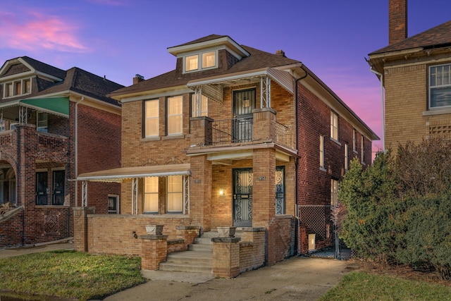 traditional style home with brick siding