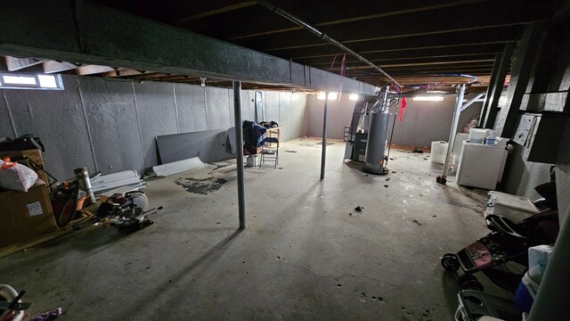 below grade area featuring water heater