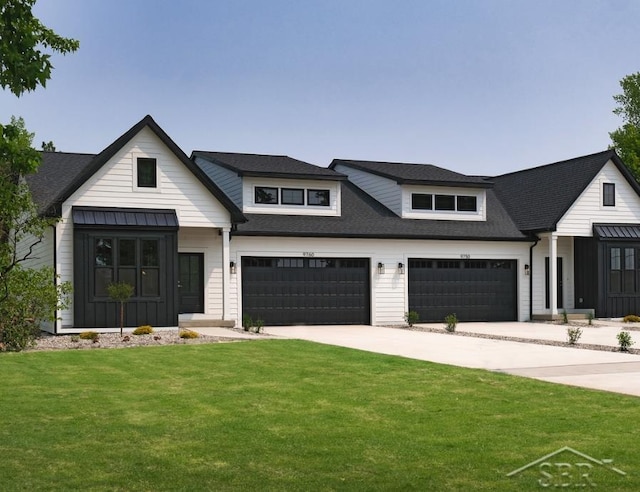 modern inspired farmhouse featuring a garage, driveway, roof with shingles, board and batten siding, and a front yard