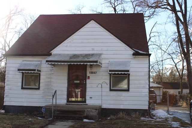 view of front of house with a shingled roof