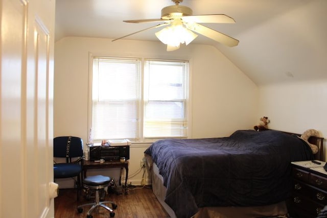 bedroom with lofted ceiling, dark wood-style flooring, and ceiling fan