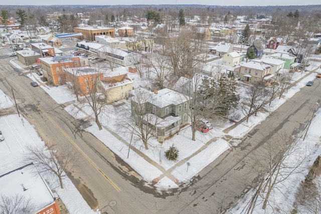 snowy aerial view featuring a residential view