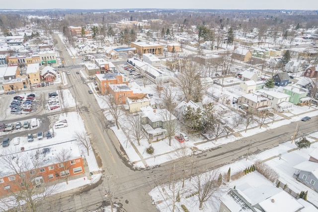 snowy aerial view featuring a residential view