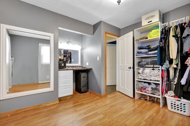 interior space featuring light wood-type flooring and built in desk