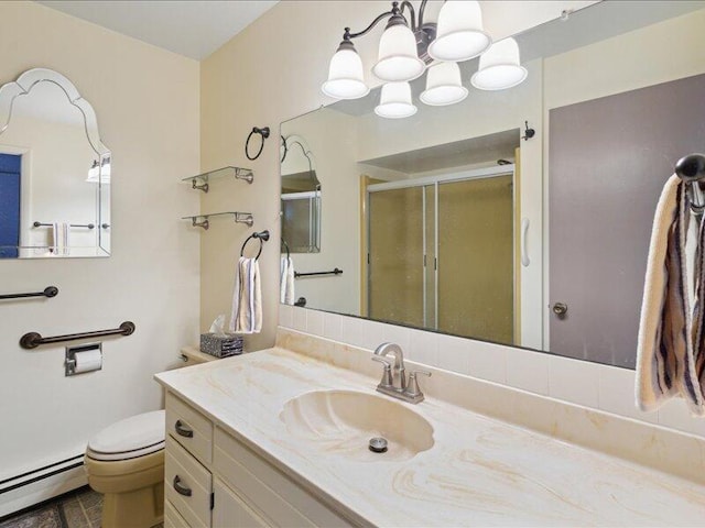 bathroom featuring a stall shower, toilet, a baseboard radiator, an inviting chandelier, and vanity