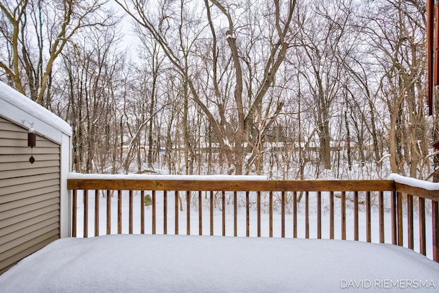 view of snow covered deck