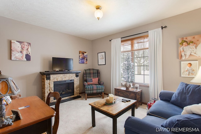 living area with light carpet, a textured ceiling, and a stone fireplace