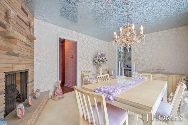 dining room with carpet floors, a fireplace with raised hearth, a textured ceiling, and wallpapered walls