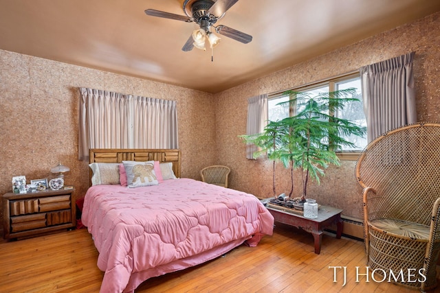 bedroom featuring ceiling fan and wood finished floors