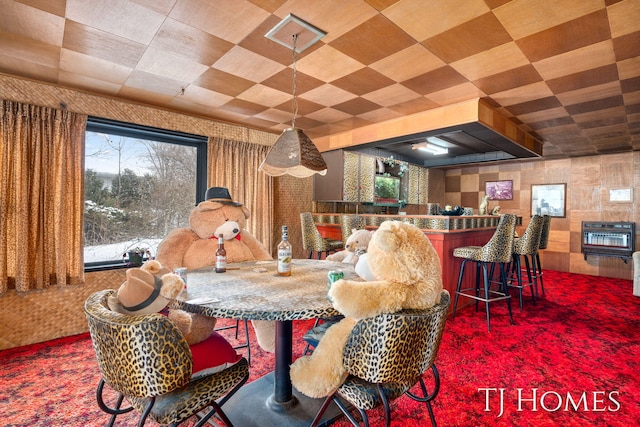 dining space with a dry bar and heating unit