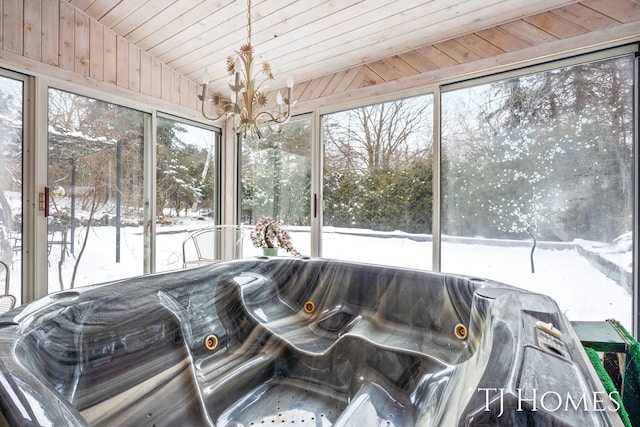 sunroom / solarium featuring vaulted ceiling, wood ceiling, and an inviting chandelier