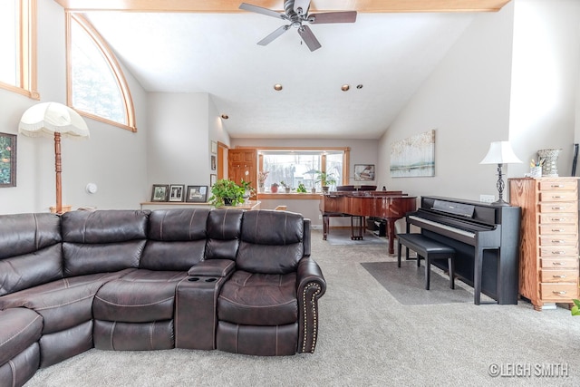 carpeted living area with high vaulted ceiling and a ceiling fan