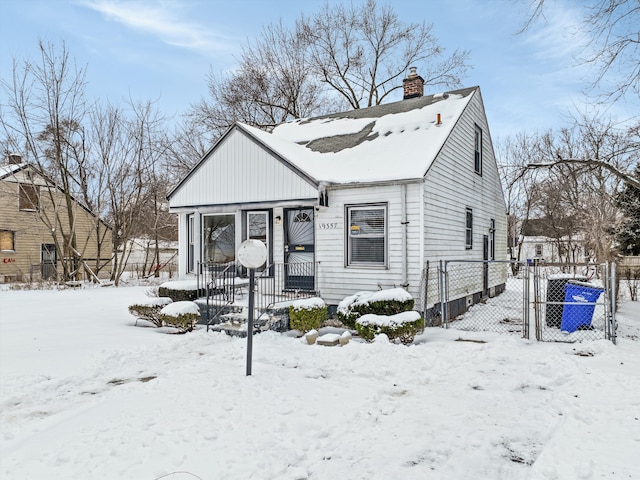 view of front of home featuring a chimney and fence