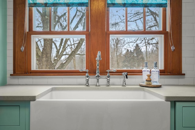 interior details featuring light countertops and a sink