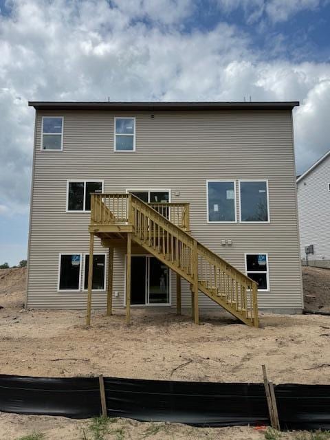 1967 Lowe Dr, Spring Lake, MI 49456 - rear view of property featuring stairs and a deck